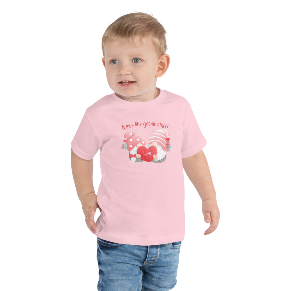 Dress your toddler in our Cute and Cozy Gnome Love Toddler T-Shirt - Short Sleeve from Raining Gifts Design. A must-have addition to their wardrobe.